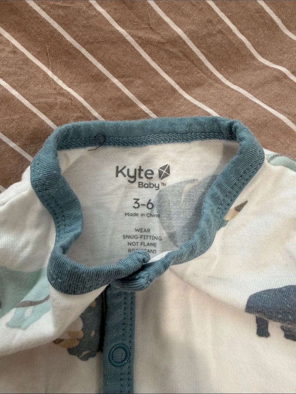 Baby One-Piece Footed Romper in White with Blue Rhino Print